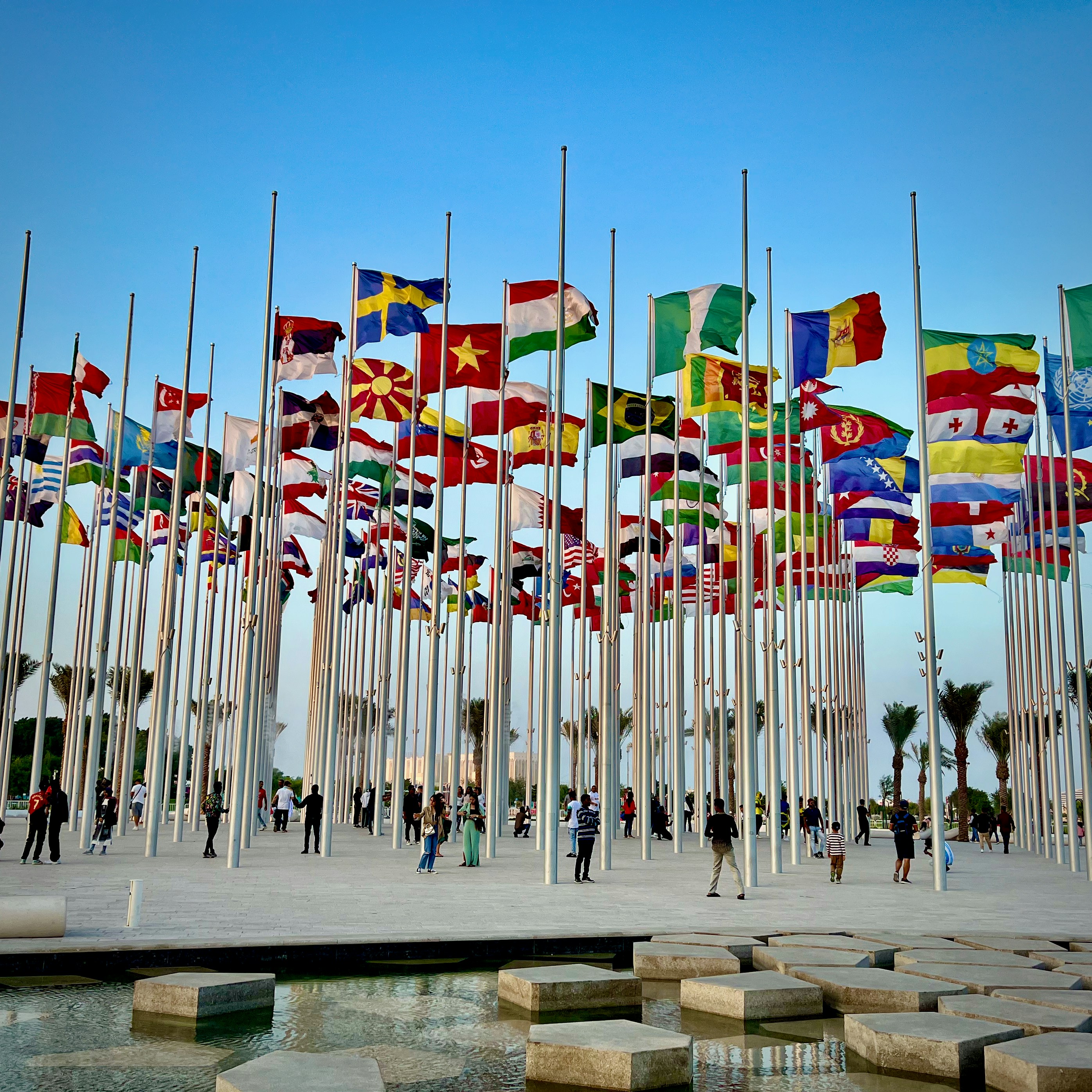 A sea of international flags filling a World Cup stadium